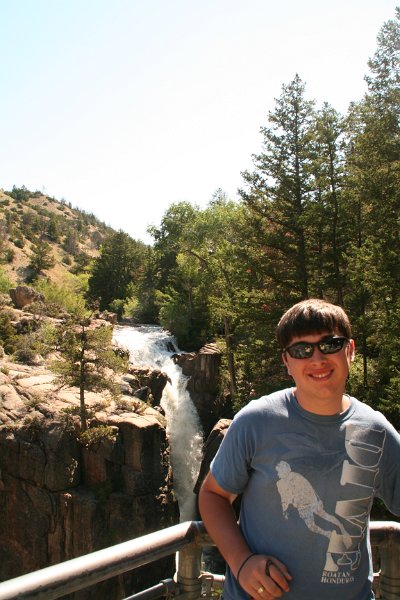 Trip (207).JPG - Kris at Shell Falls.  Shell Falls is a waterfall in the Bighorn National Forest on Shell Creek, about halfway down Shell Canyon, and a few miles upstream from the town of Shell in northeast Wyoming. The falls are 120 feet in height and tumble over basement rock of granite.